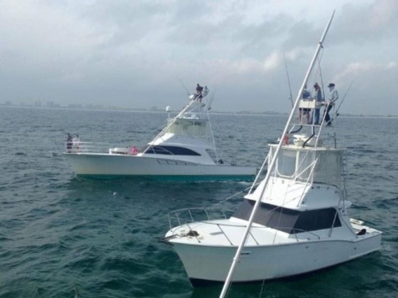 Jamie G Charters on the water next to another boat in Orange Beach, Alabama