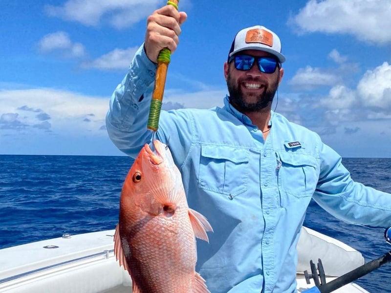 A man with his catch from JustInTime