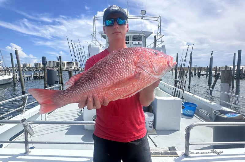 A man with his catch on the dock in Destin, Florida