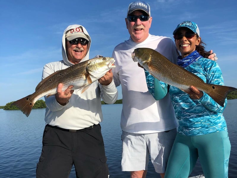 A group with their catch on board a charter fishing boat from CBs Saltwater Outfitters