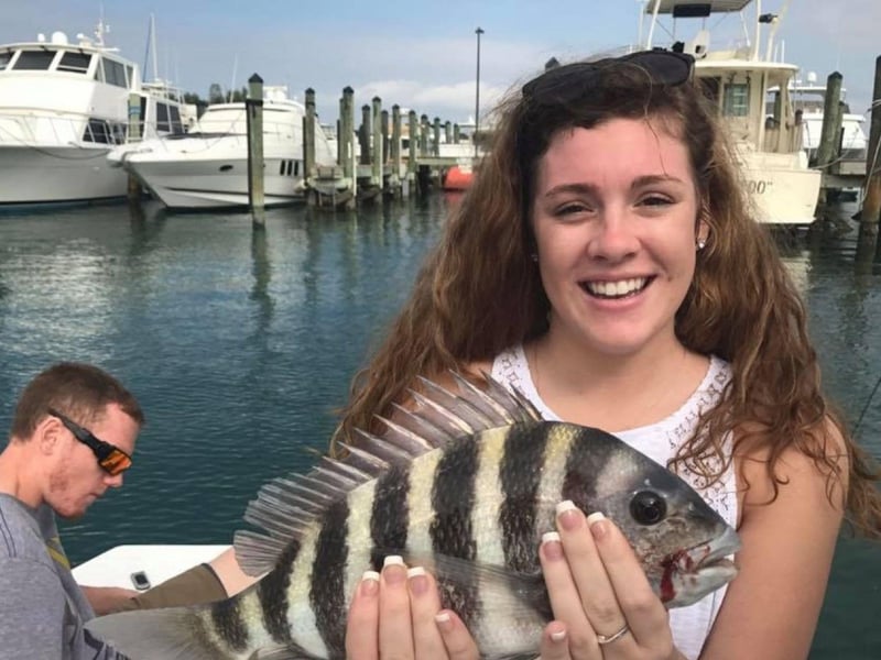 A woman with her fish at the dock in Sarasota, Florida