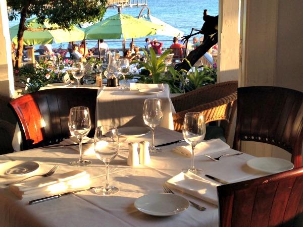 tables set for lunch and water view at Louies Backyard restaurant in Key West