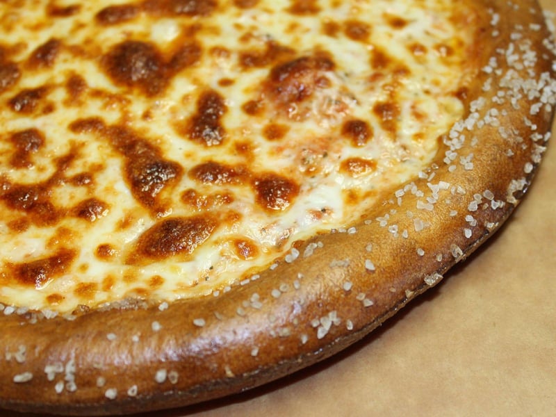 Cheese pizza with a soft pretzel crust