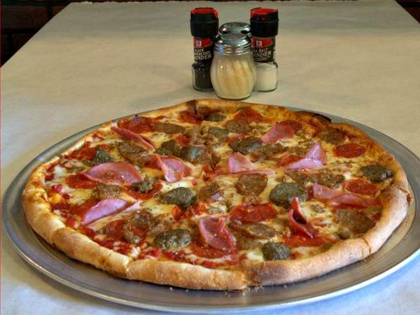 Meat lovers pizza with ham, sausage and pepperoni at Vinnie Rs.