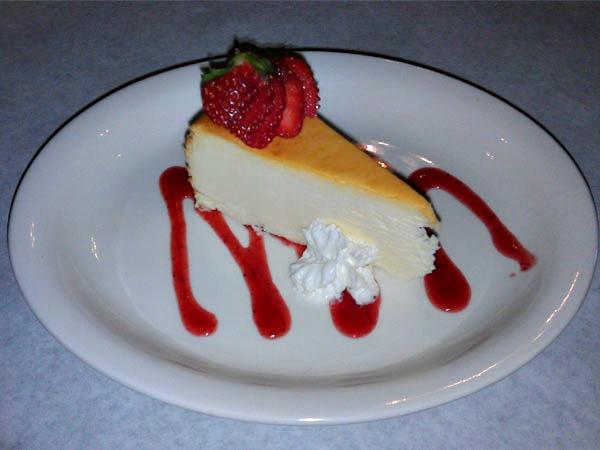 Cheesecake with strawberry sauce at Vinnie Rs in Navarre