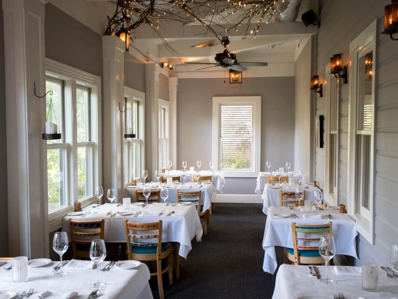 The side porch dining room at Cafe ThirtyA in Seagrove Beach, Florida