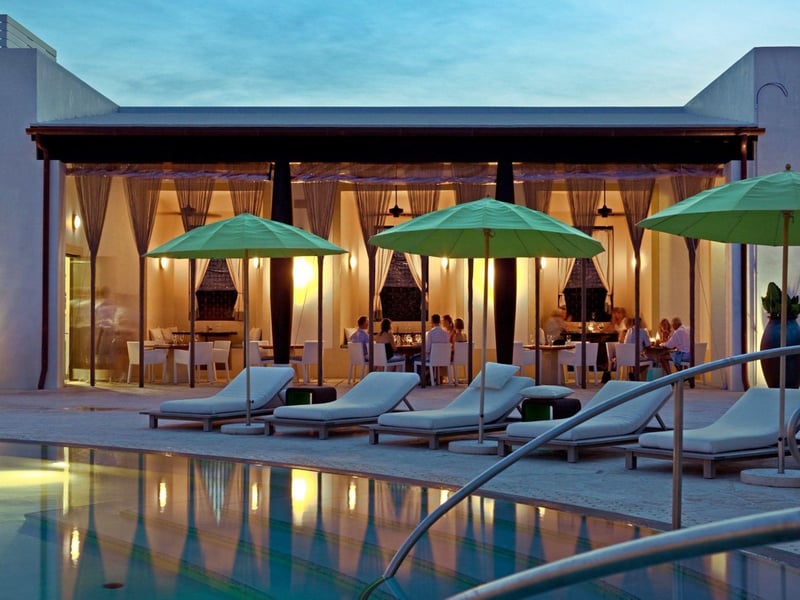 Al fresca dining next to a pool at Caliza in Alys Beach, Florida