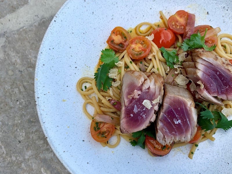 Seared yellow fin tuna over linguini from Caliza Restaurant in Alys Beach, Florida