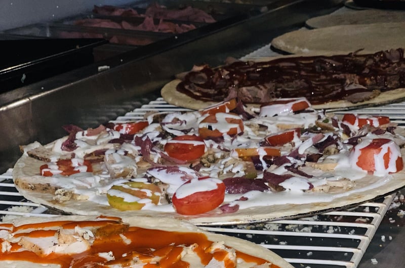 Pizzas cooking in the oven at Brunos Pizza in Watersound Beach, Florida