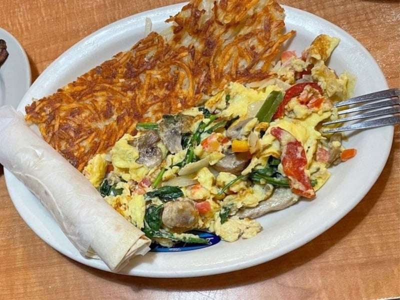 An omlette and hashbrowns from the Donut Hole in Santa Rosa Beach, Florida