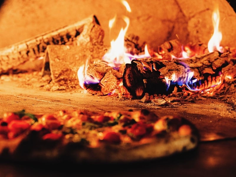 A pizza in the oven at Fat Clemenzas