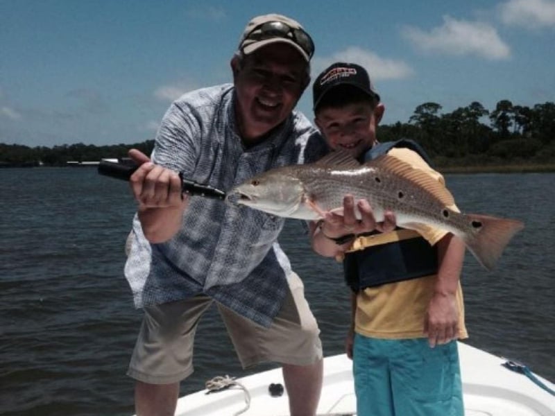 A group with their catch on board GameO in Orange Beach, Alabama