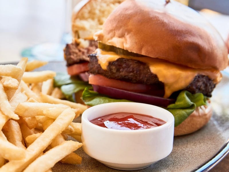 A cheeseburger with french fries