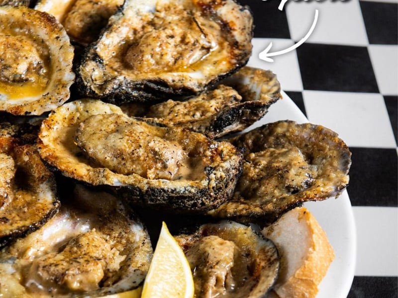 Chargrilled oysters at Acme Oyster House