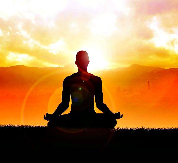 Aluna Wellness Center Anna Maria Island woman practicing yoga pose at sunrise