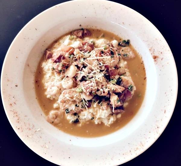 plate of shrimp and grits at Little New Orleans restaurant in Orange Beach