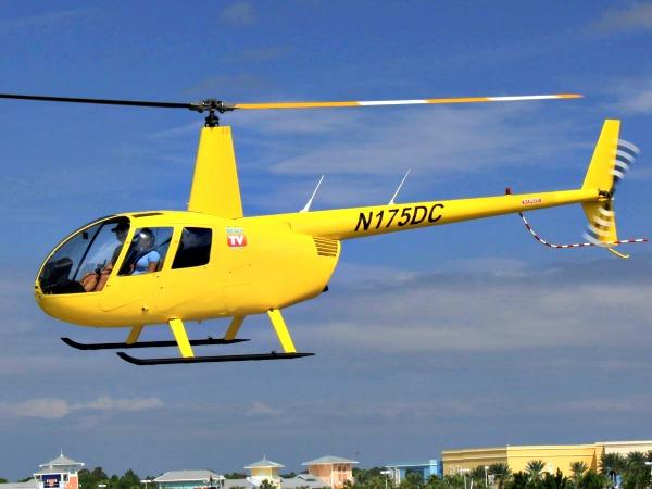 Yellow helicopter in the air over Panama City