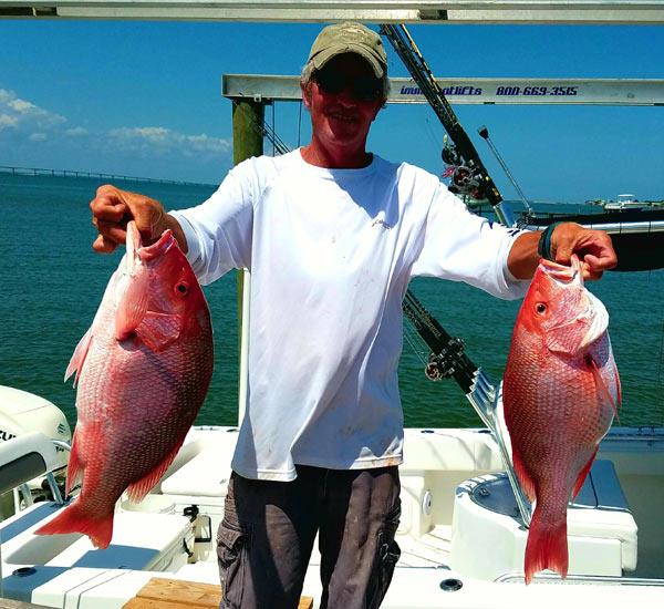 Catching red snapper on Bay View Fishing Charters on St. George Island, Florida