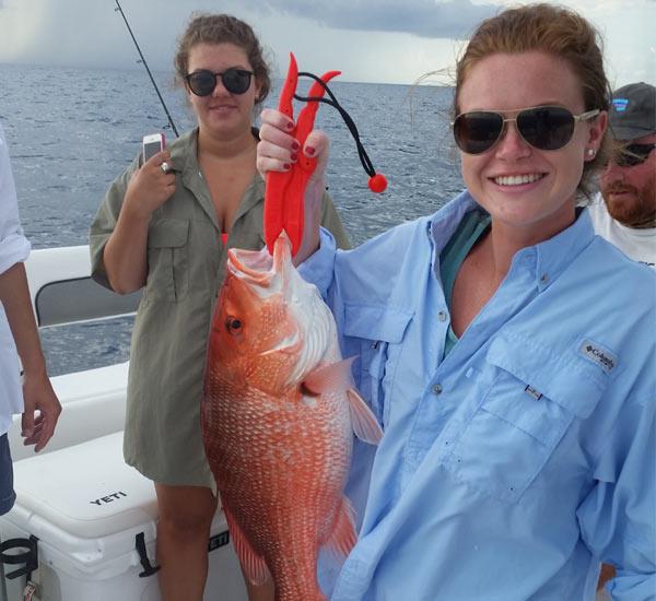 Catching red snapper in St. George Island aboard the Bay View Charters fishing boat