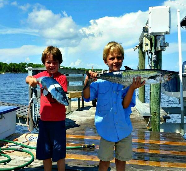 Kids having fun fishing aboard Bay View Charters on St. George Island Florida