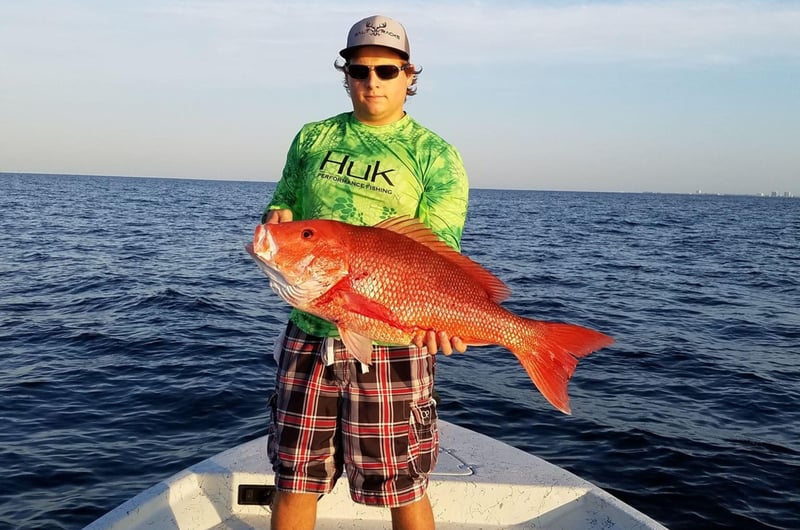 A man with his catch on board Cant Quit Fishin in Gulf Breeze, Florida