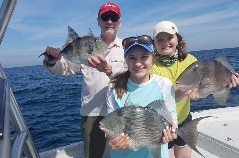 A family on board Cant Quit Fishin in Pensacola, Florida