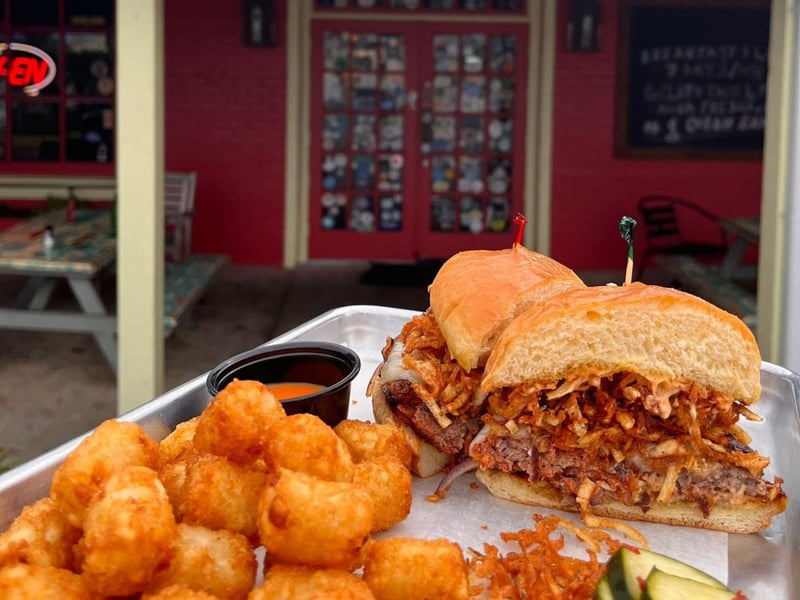 The chorizo burger with potato sticks and sauteed onion