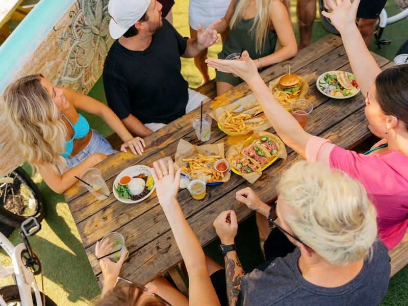 A group at a table at Chiringo in Santa Rosa Beach, Florida