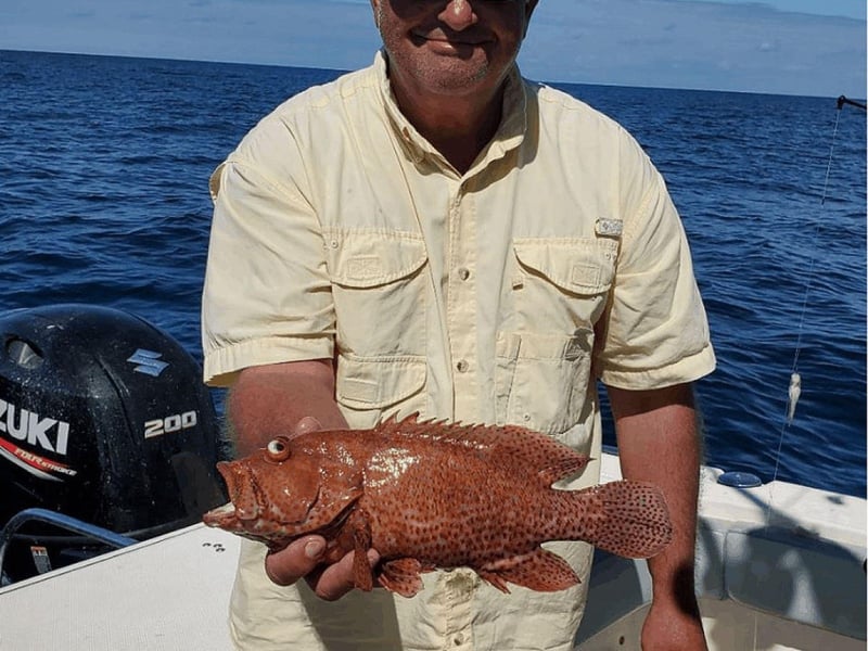 A man with his catch off the coast of Fort Walton Beach, Florida