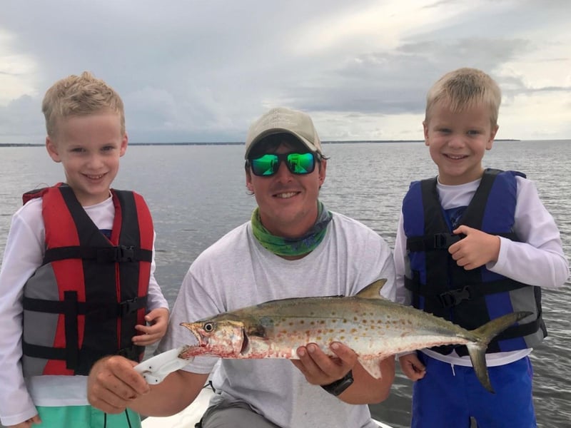 A family on Last Call with their catch in Destin, Florida