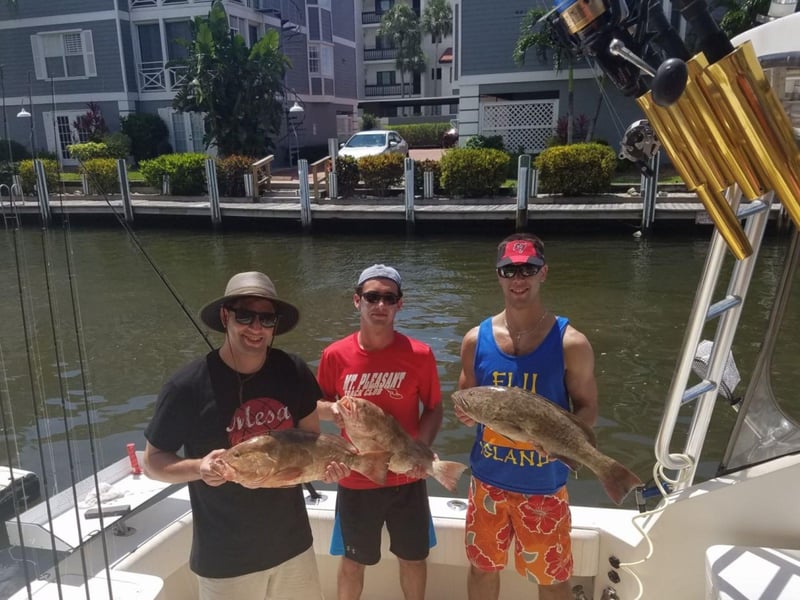 A group with their catch from Siesta Key Sport Fishing Charters in Sarasota, Florida