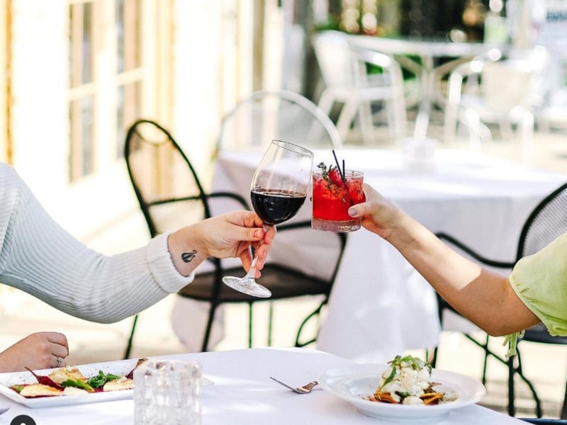 Two people with their wineglasses at Jacksons Restaurant