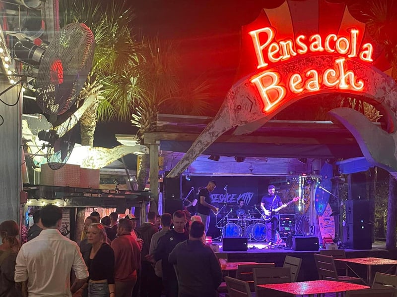 A band preforming on the stage at Flounders Chowder House in Pensacola Beach, Florida