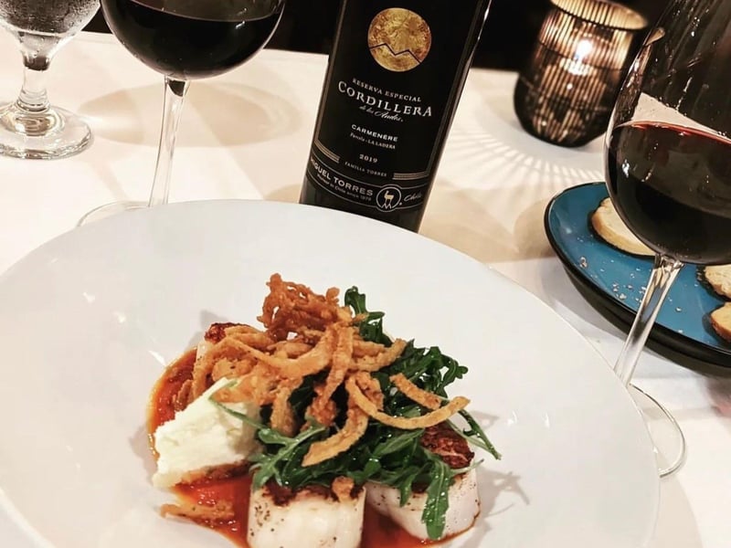 A tapas dish with a wine bottle from The Global Grill