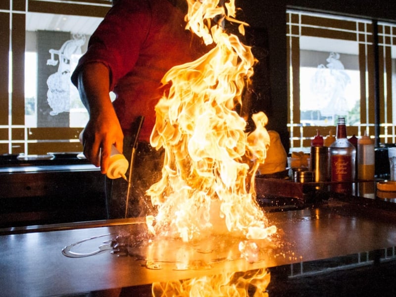 A chef at a hibachi grill at Tokyo Japanese Steakhouse