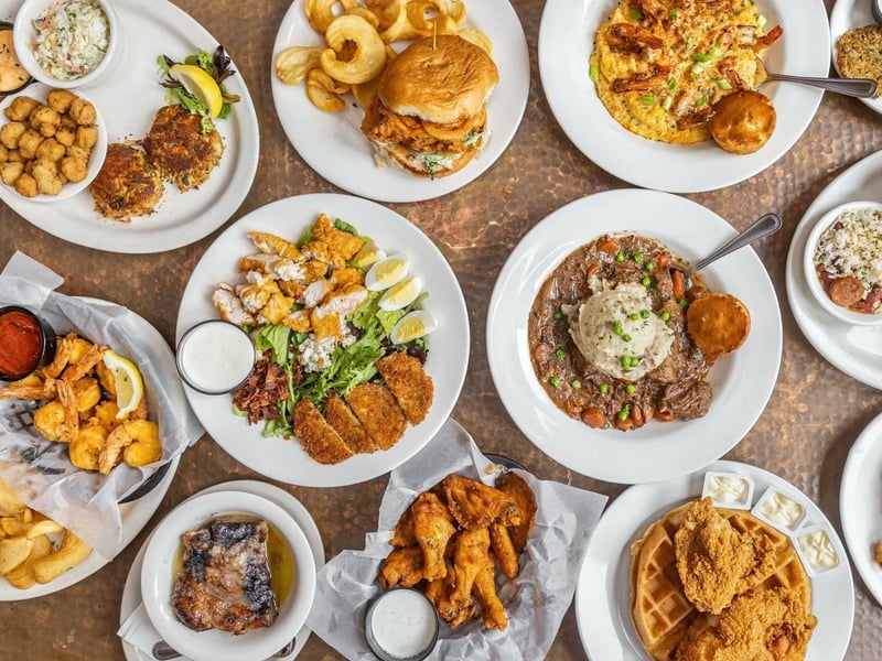 A large spread on a table at Five Sisters Blues Cafe in Pensacola, Florida