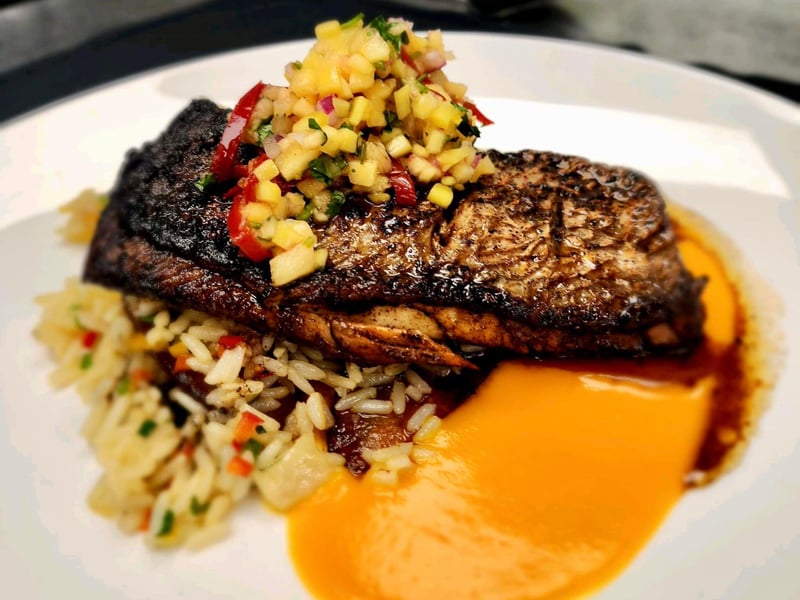 Mangrove Snapper with fried plantains and a pineapple mango salsa at Firefly in Panama City Beach, Florida