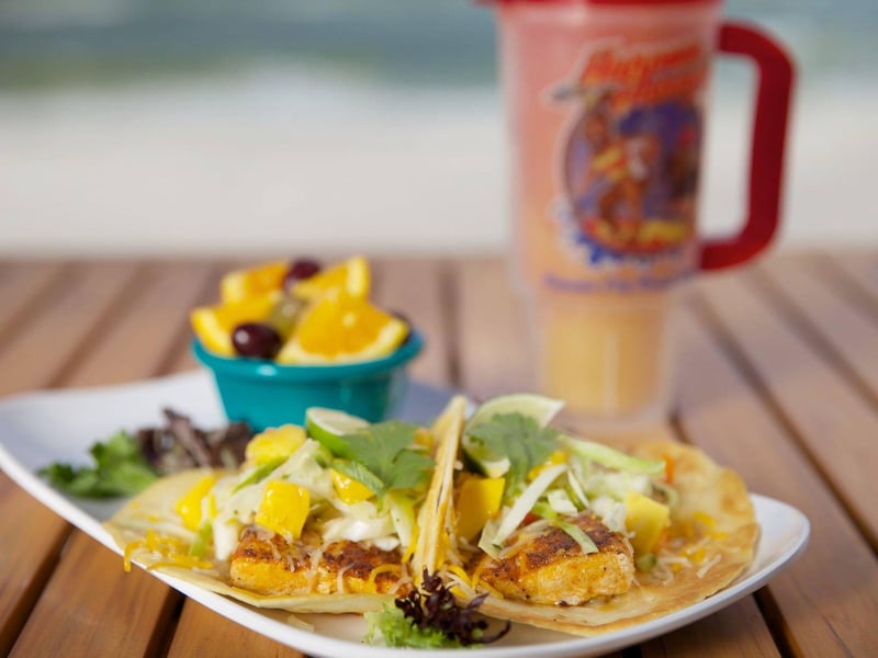 The fish tacos with fruit and a frozen cocktail at Harpoon Harrys