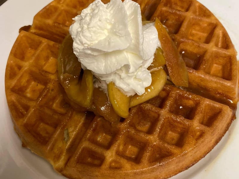 The malted waffle with a homemade apple topping and whipped cream