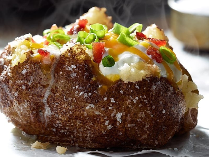 A loaded baked potato frmo Longhorn Steakhouse in Panama City Beach, Florida