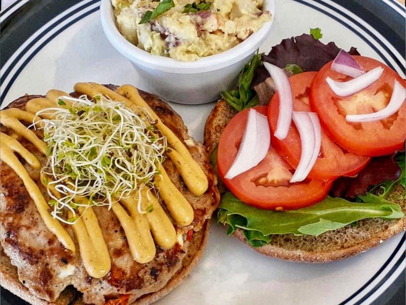 A housemade veggie burger with potato salad