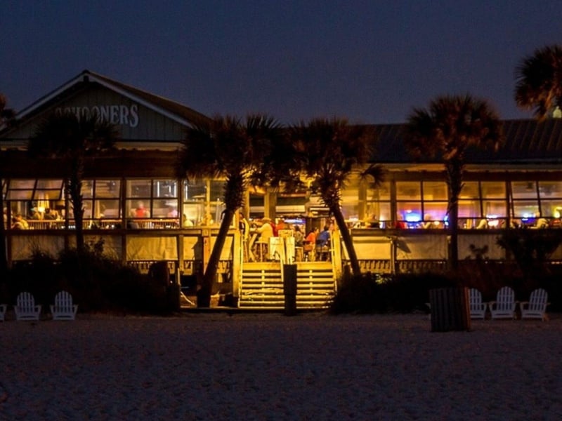 Dine right on the beach at Schooners