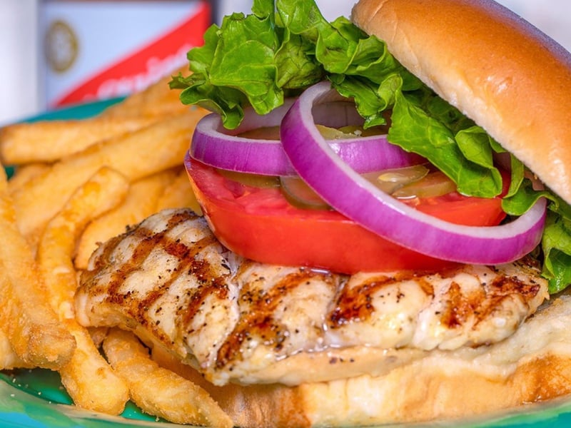 The grilled chicken sandwich with fries at Schooners