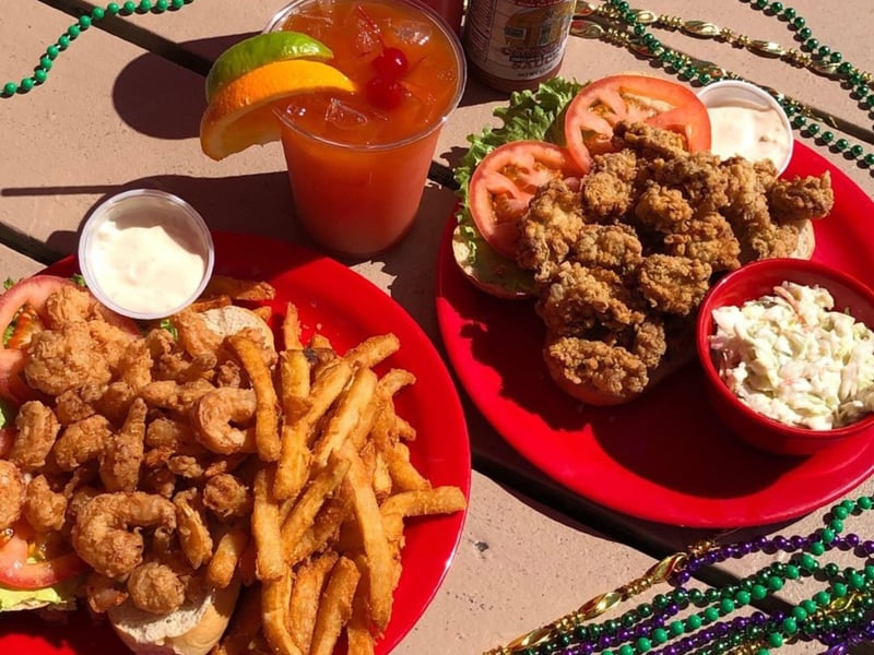 Two plates and a cocktail from Shuckums in Panama City Beach, Florida