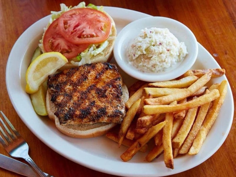 The Amberjack sandwich with fries and coleslaw