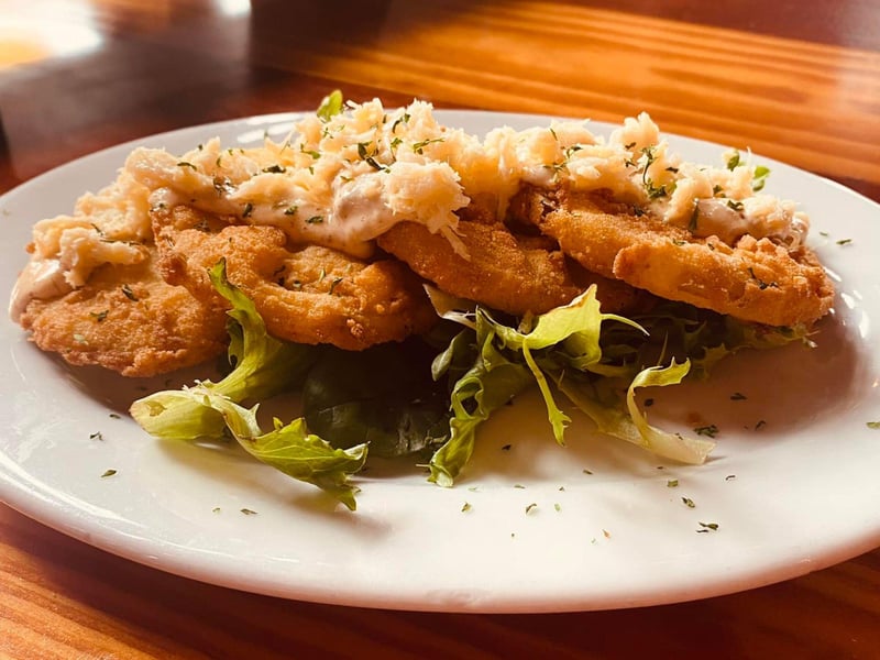 Gulf grouper topped with bay shrimp and a melon caper beurre blance sauce