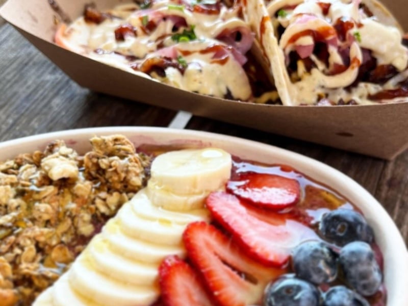 A smoothie bowl and brisket tacos
