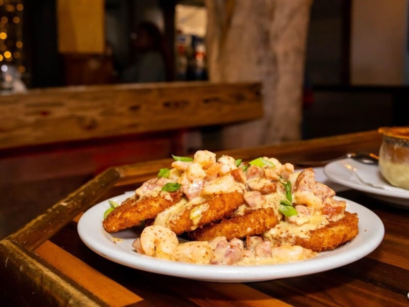 Fried green tomatoes topped with shrimp and spicy andouille sausage from AJs in Fort Walton Beach, Florida