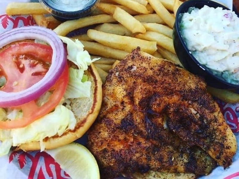 The grilled fish sandwich with fries from AJs on the Bayou