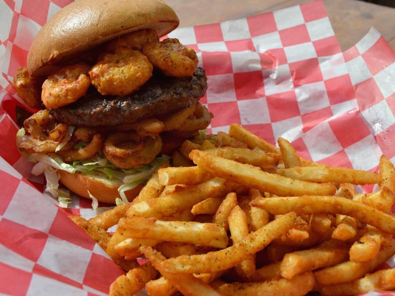 The specialty house burger topped with pow pow shrimp from Anglers in Fort Walton Beach, Florida